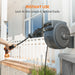 Giraffe Tools Retractable Garden Hose Reel in a backyard setting