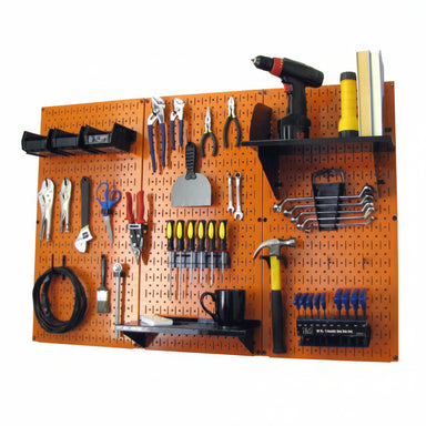 Orange pegboard wall with various tools and equipment on a white background