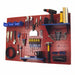 Red pegboard wall organizer with various tools on a white background