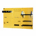 Yellow pegboard with various tools and brackets on a white background