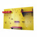 Yellow pegboard with red and purple shelves and hooks on a white background