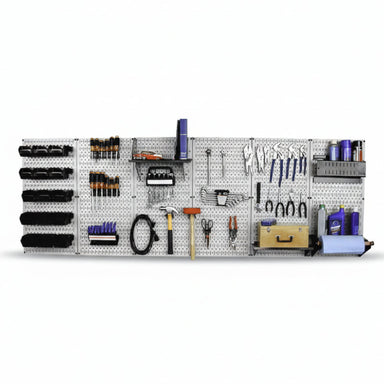 Wall-mounted tool organizer with various tools on a pegboard