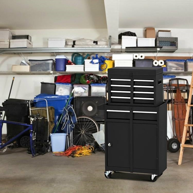 Black tool chest in a cluttered garage with various items.