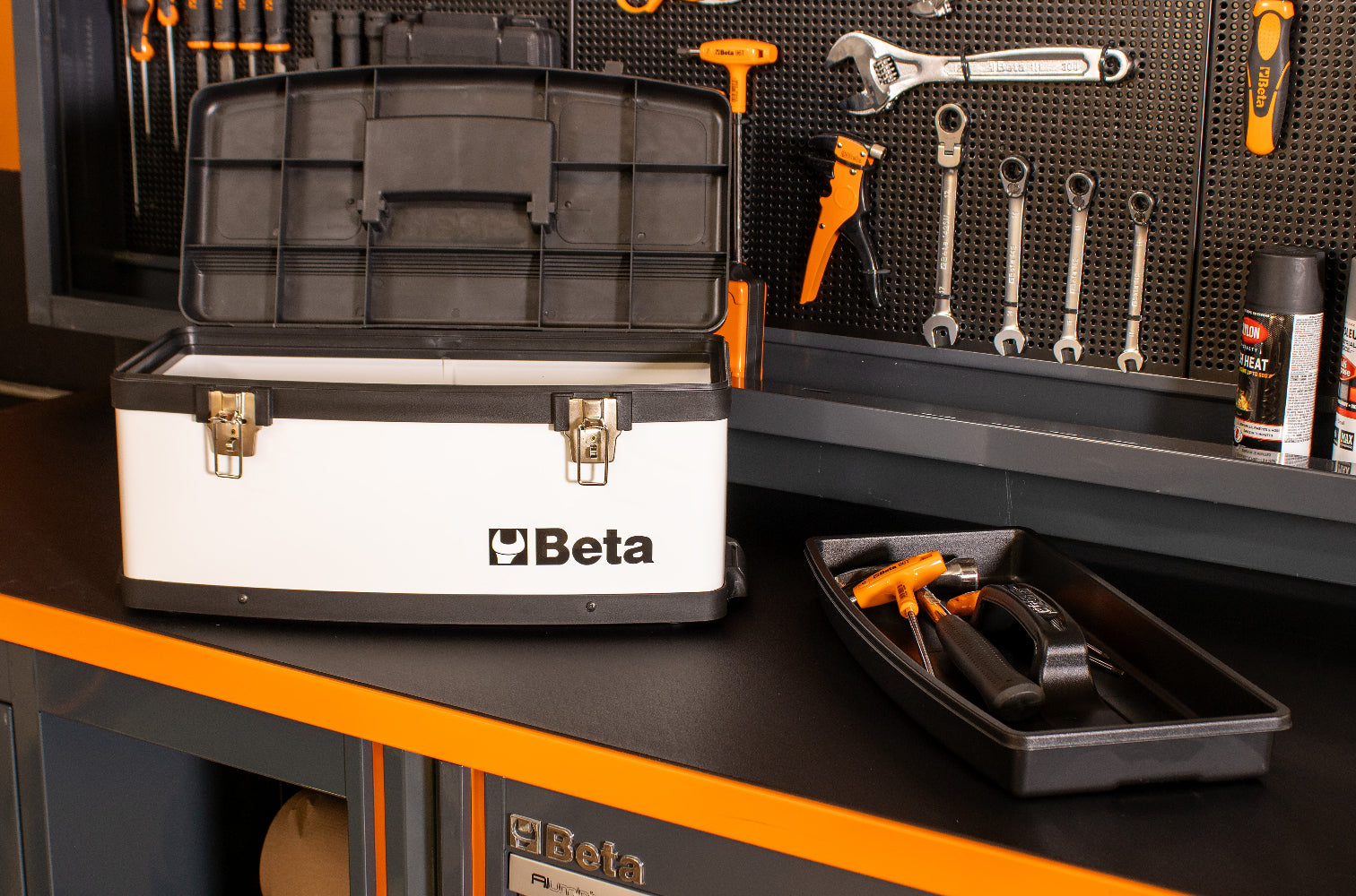 Close up of white Beta toolbox on a workbench with tools in the background