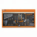 Wall-mounted tool organizer with various tools on a black pegboard against an orange background