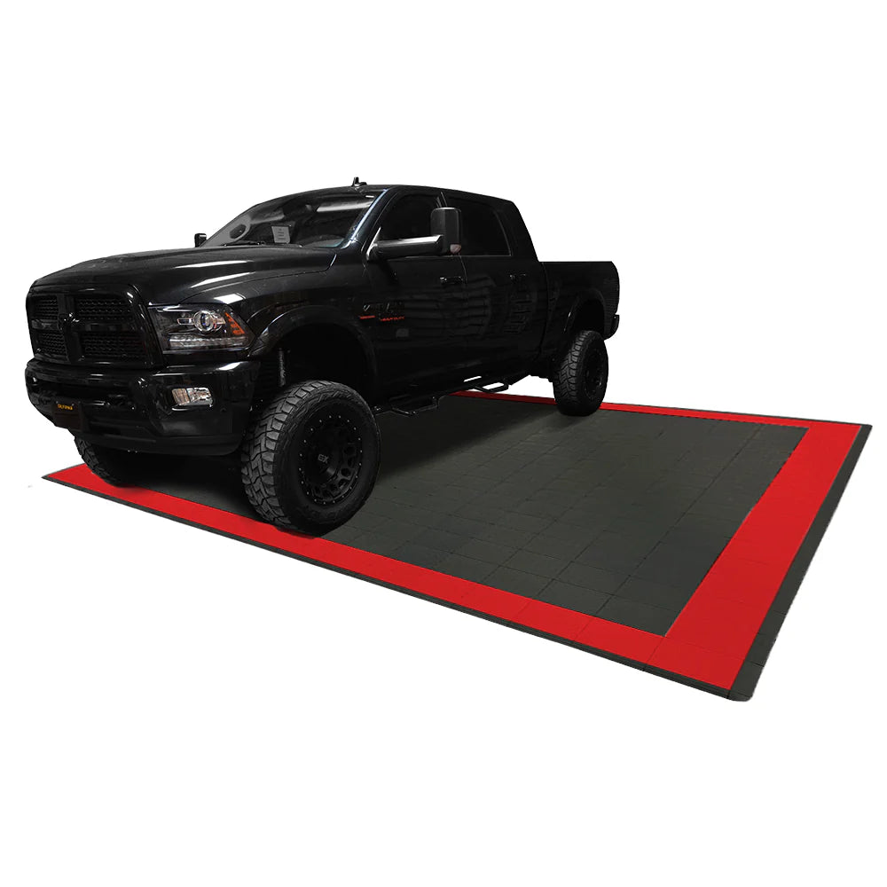 Black truck on a black and red mat with a white background