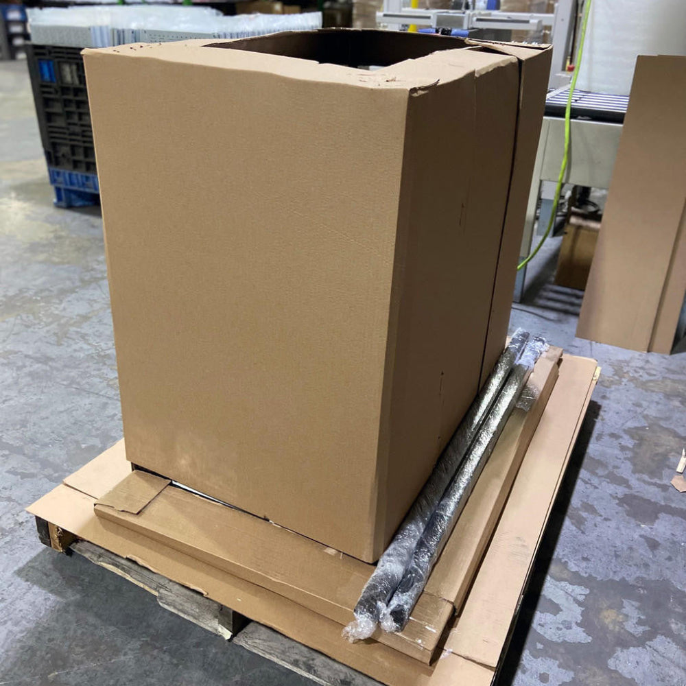 Assmebled workbench and pegboard in packed on pallet in warehouse setting