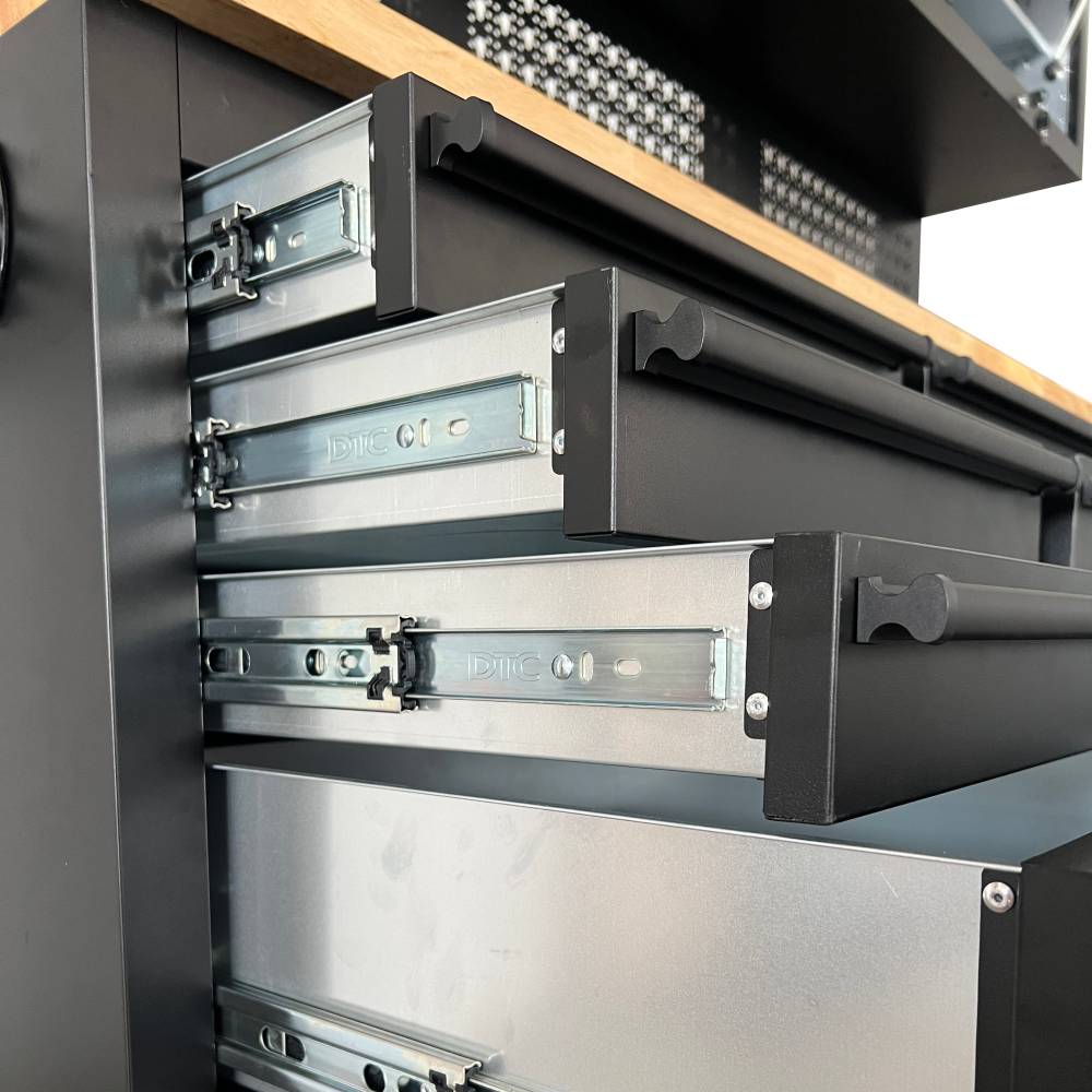 Metal drawers with slides on a black metal cabinet