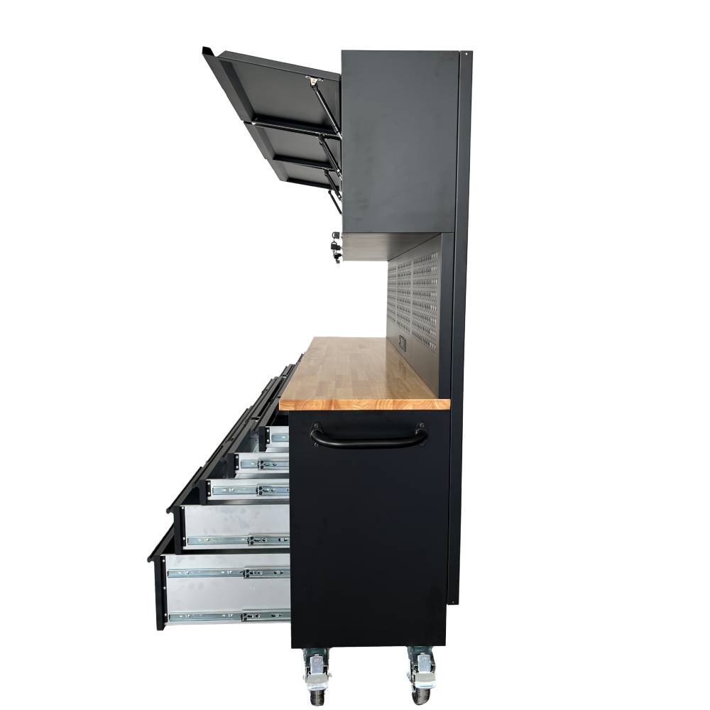 Black workshop cabinet with wooden top and open drawers on a white background