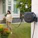 Giraffe Tools Retractable Garden Hose Reel mounted on an outdoor wall