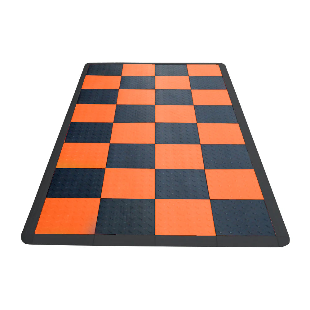 Checkered mat with orange and black squares on a white background