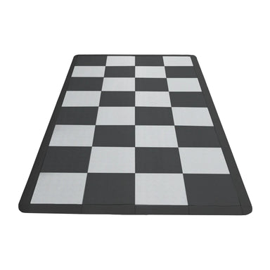 Checkered black and white mat on a white background