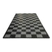Checkered black and gray rug on a white background