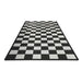 Checkered black and white rug on a white background