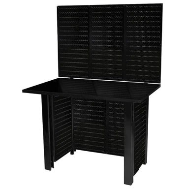 Black workbench with black pegboards against a white background