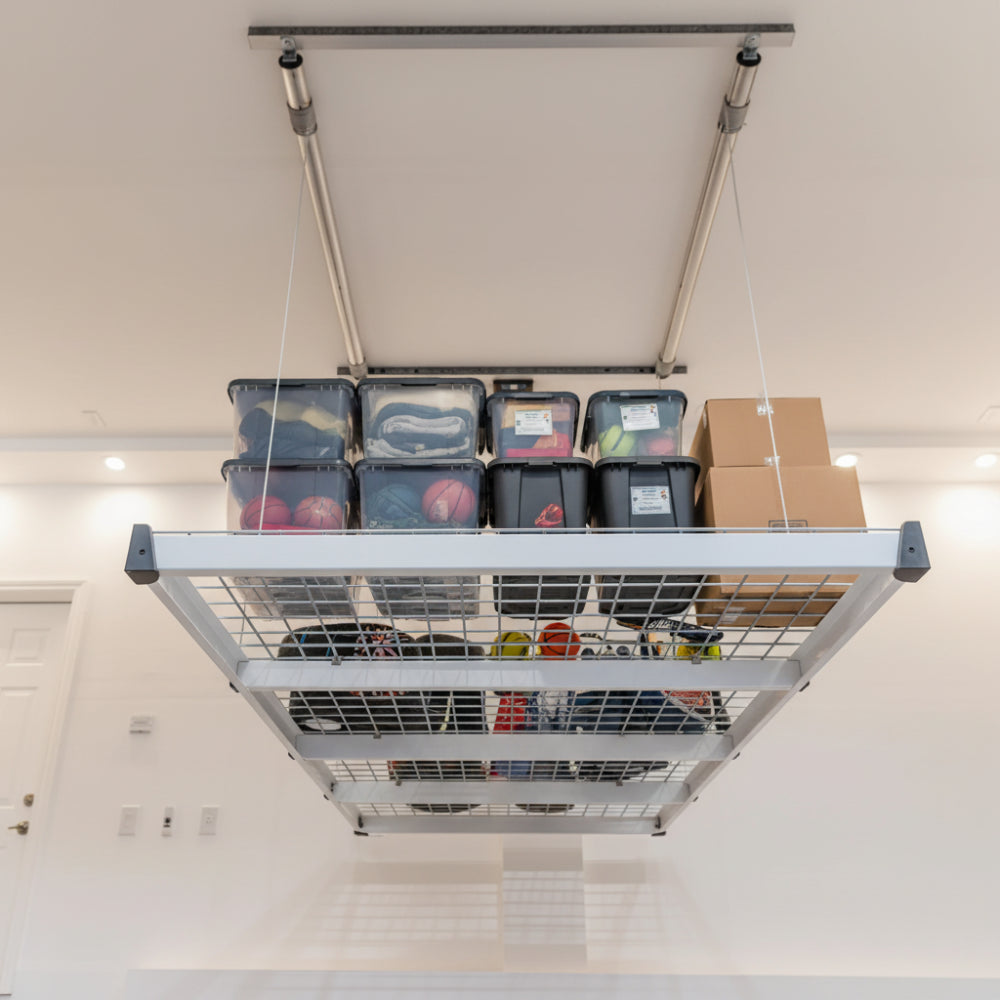 Auxx Lift extended down from ceiling with storage totes