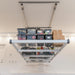 Auxx Lift extended down from ceiling with storage totes