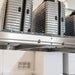 Auxx Lift in stainless steel close-up with luggage