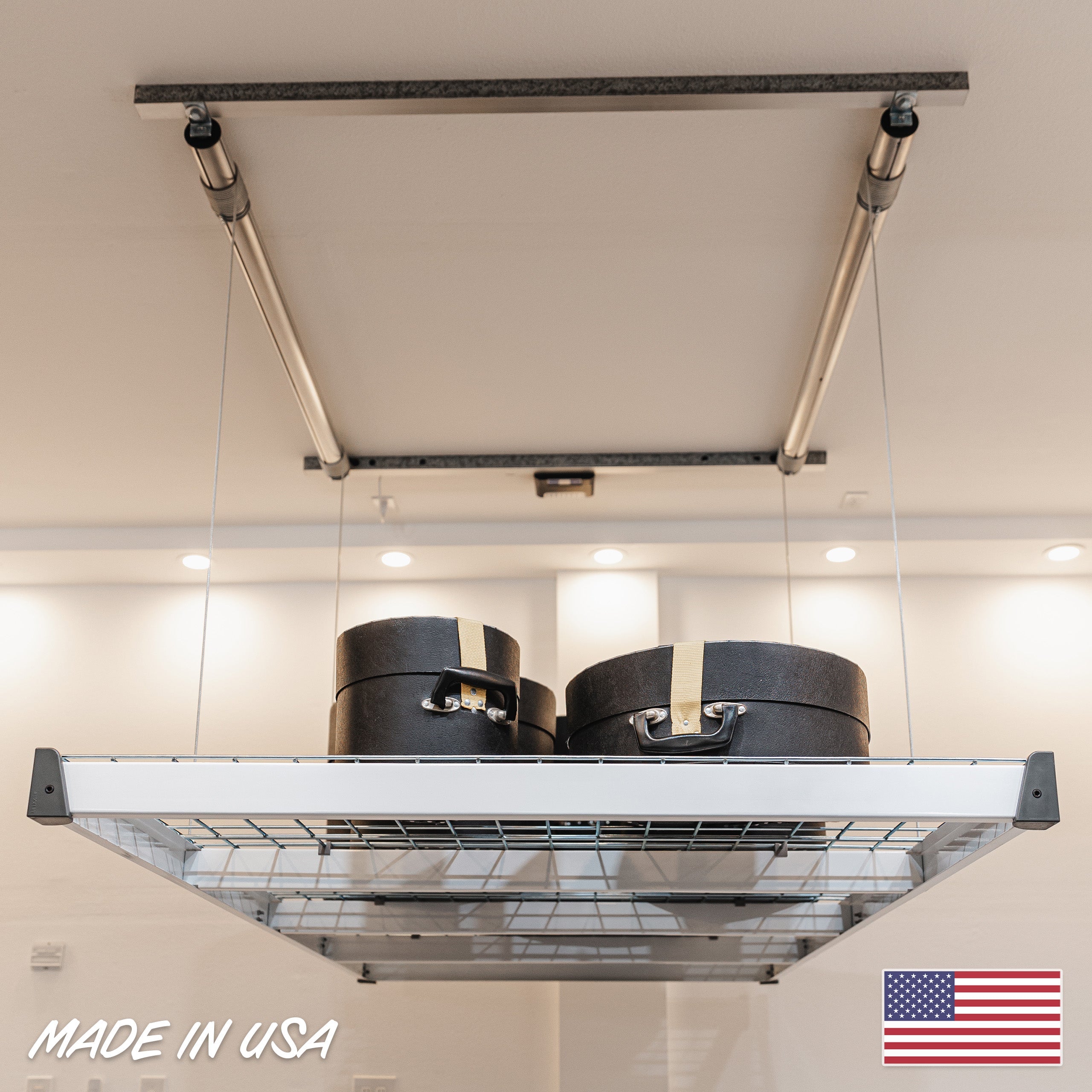 Auxx-Lift Motorized Garage Ceiling Storage Lift in silver gray installed in garage