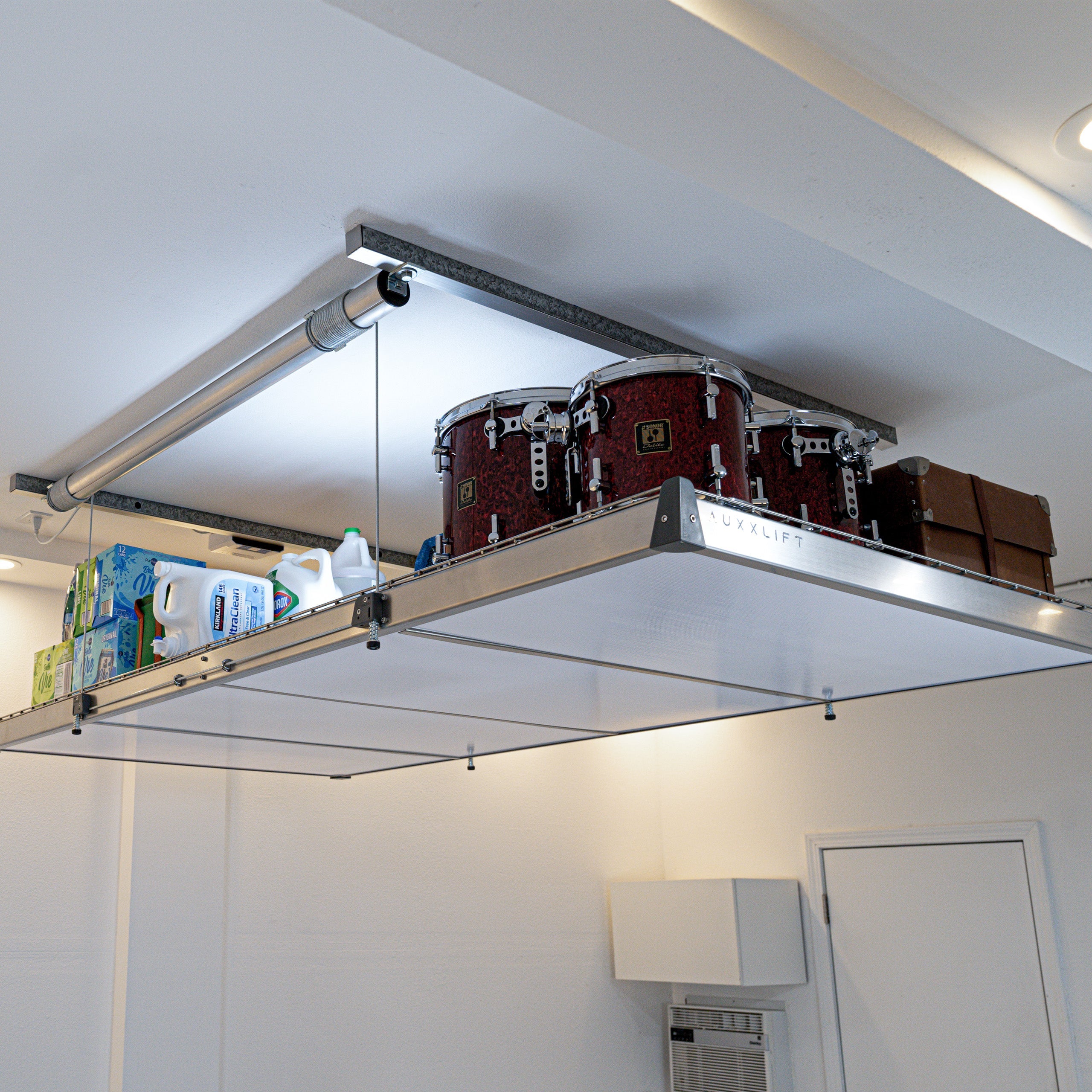 Auxx-Lift Motorized Garage Ceiling Storage Lift raised with drum kit