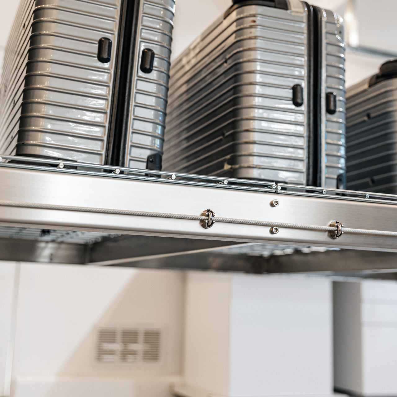 Auxx-Lift Motorized Garage Ceiling Storage Lift close up with luggage