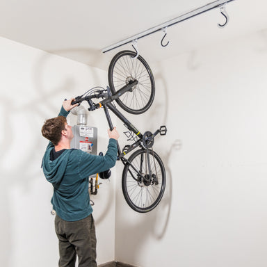 ceiling-sam-bike-slide-man-hanging-bike