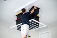 ceiling-sam-heavy-duty-pro-4x6-installed-man-storing-totes