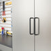 Metal cabinet with black handle in a workshop setting