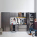 Modern garage storage system with tools and equipment, featuring a person interacting with the cabinets.