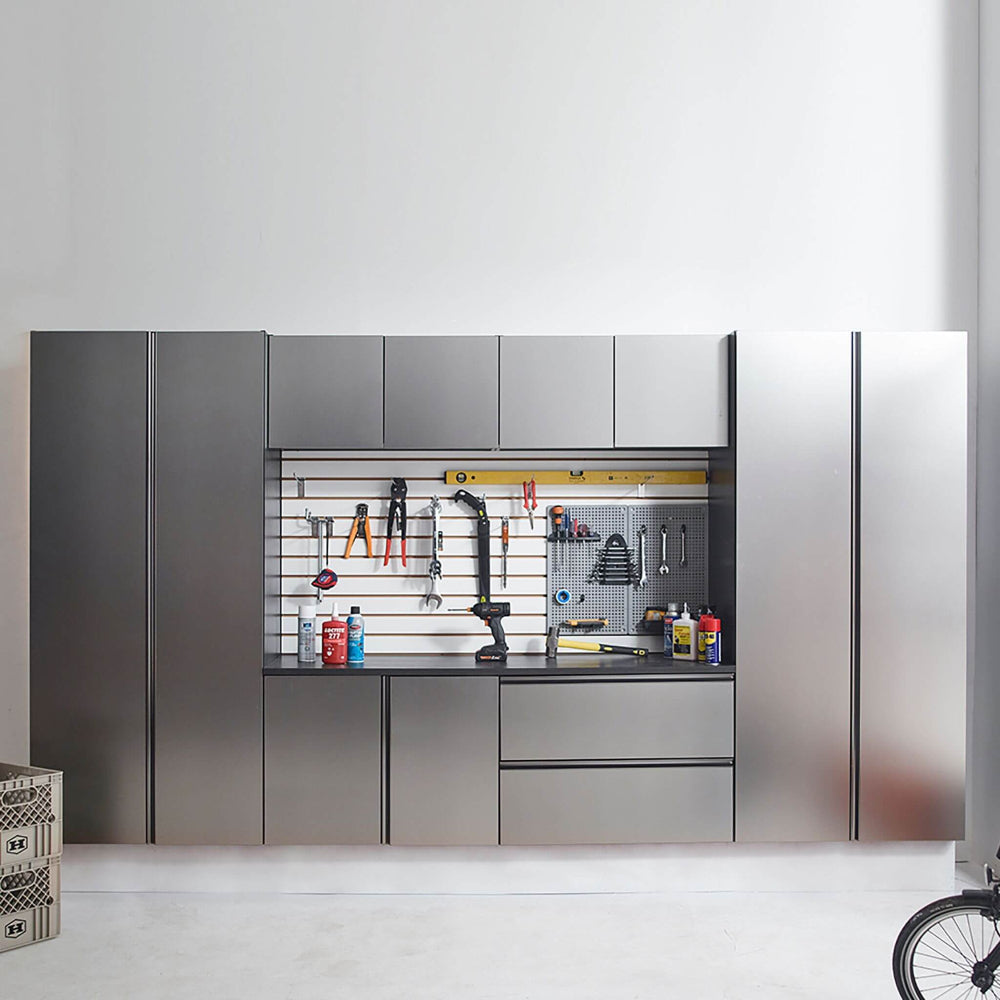 Modern garage storage cabinet with tools and equipment on a white background