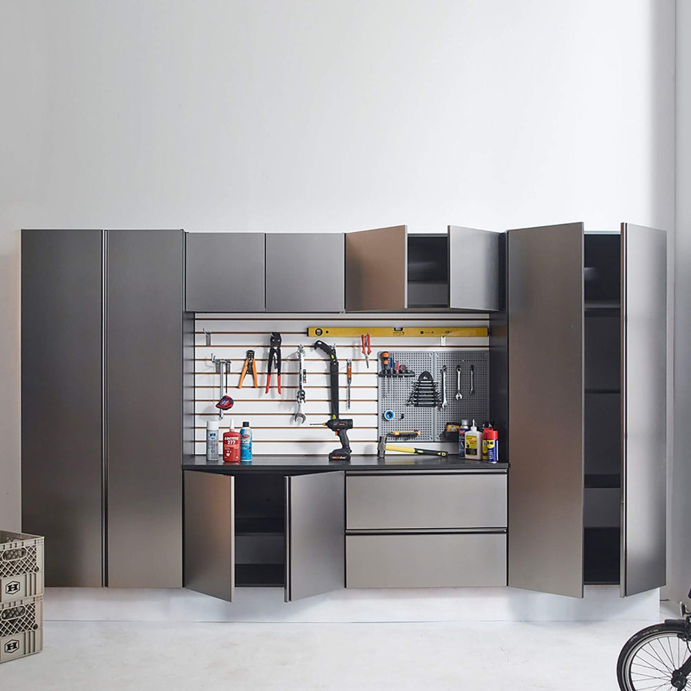 Modular garage storage system with open shelves and tools on a white background