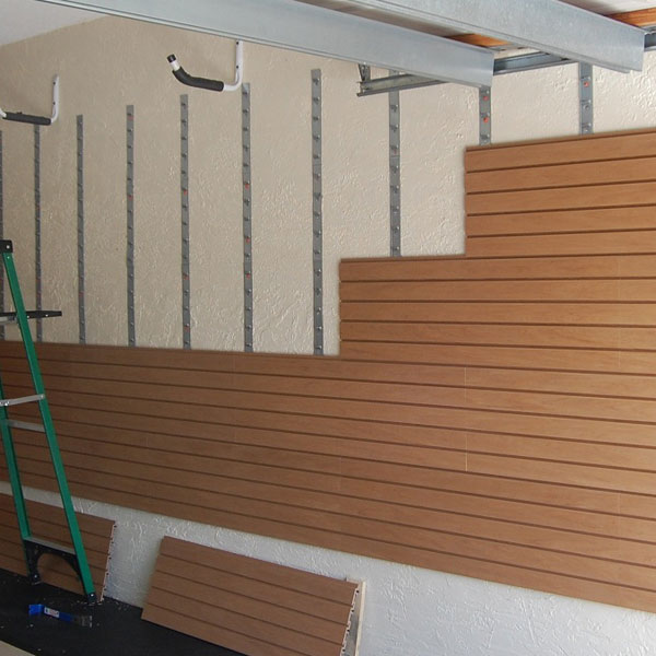 storeWALL InstallStrip being installed in garage on large wall
