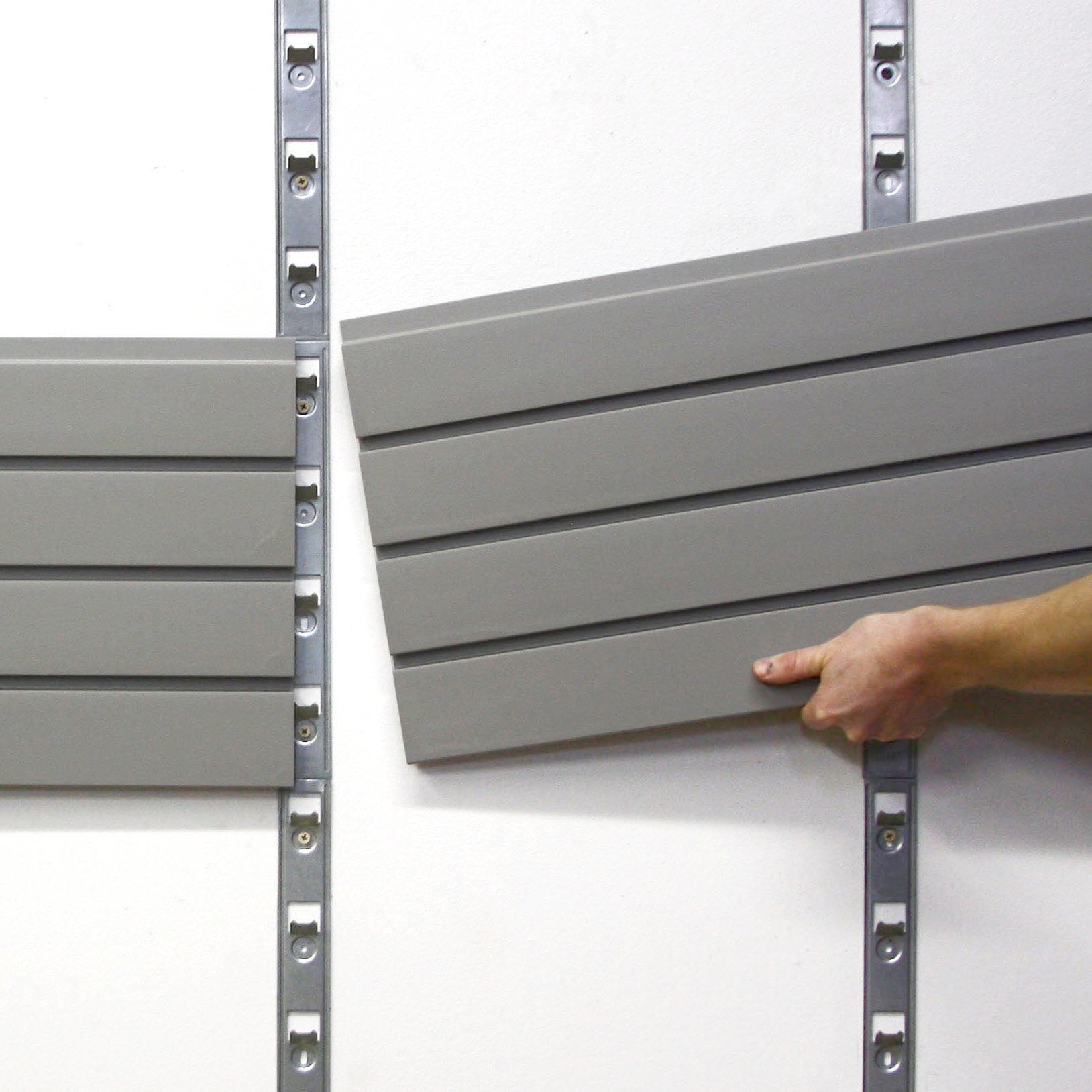 storeWALL Installstrip installation on white wall